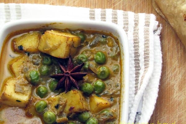 Mutter paneer, the Indian classic curry is kept in a bowl to serve.