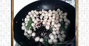 seasoning the  Indian rice balls.
