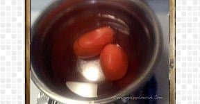 Soak tamarind ball in half cup of warm water for tomato rasam recipe.