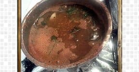 In a bowl, add the tomato puree, tamarind extract to make Andhra style tomato rasam recipe.