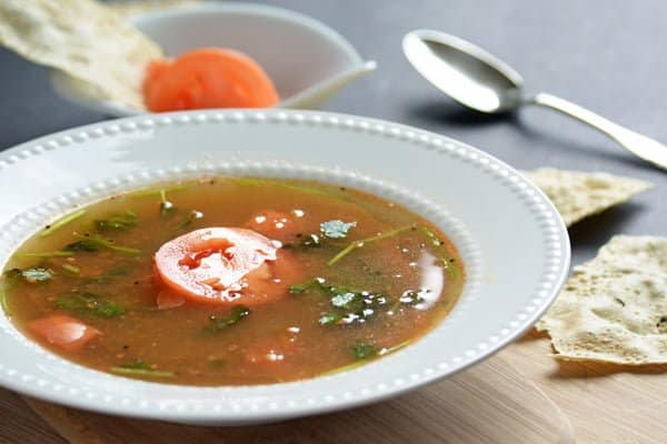 dry roasting and grinding the spices in this tomato rasam recipe, you can straight away add readymade rasam powder mixture. 