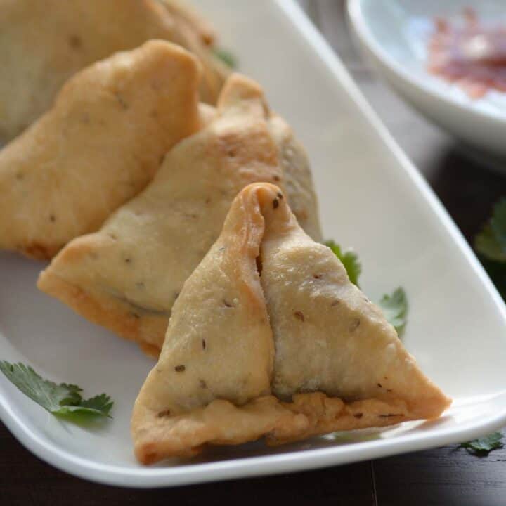 lets learn how to make samosa, placed in white plate