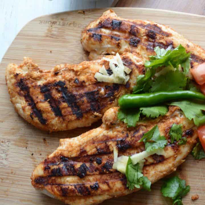 tandoori grilled chicken in the cutting board