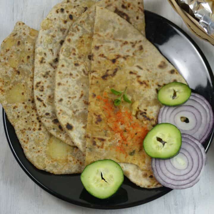 aloo paratha in a black plate