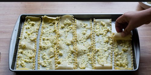 Start rolling the meatless lasagna roll ups.