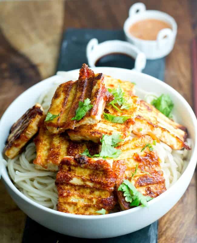 Spicy tofu steak is grilled, fabulous, and healthy appetizer. It's crisp outside and soft and creamy inside. This vegan dish is great to serve with vegetables, rice, noodles. 