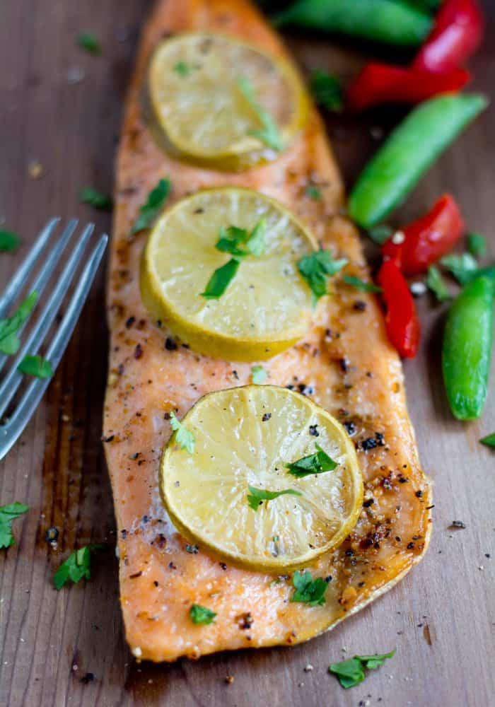 Grilled Cedar Plank Salmon recipe, yields soft, juicy smoke flavored salmon with the right hint of herbs. The salmon great in taste and texture something similar to the restaurant's quality.