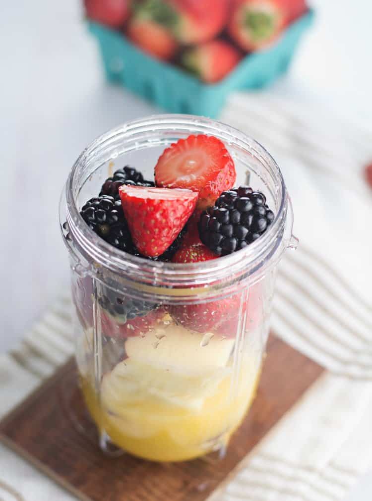 fresh fruits are added to the blender jar.