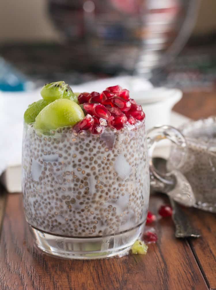 Canned coconut milk chia pudding recipe topped with coconut slices, kiwi, and pomegranate. A perfect healthy breakfast recipe. No cooking is necessary, just add the ingredients wait for half an hour or refrigerate overnight.