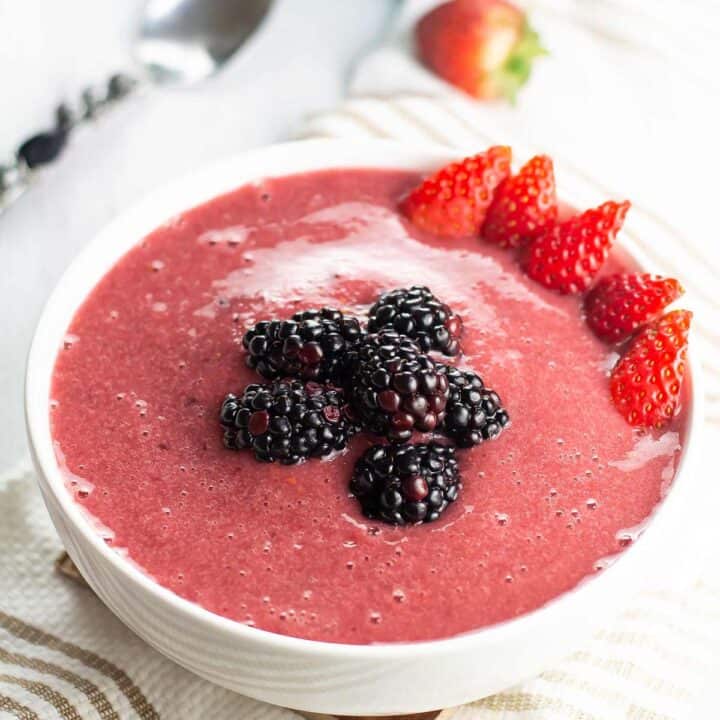 berry smoothie bowl with fresh fruits ready for breakfast