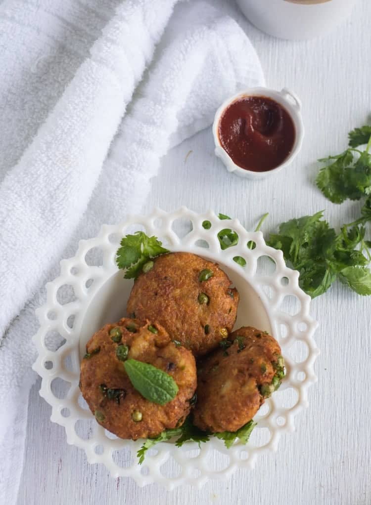 Bread cutlet is quick and instant Indian style tea time snack. Perfect to serve for kids, family and parties. Made with bread, potato, green peas and carrot. This tikki is deep fried dish with loads of vegetables.