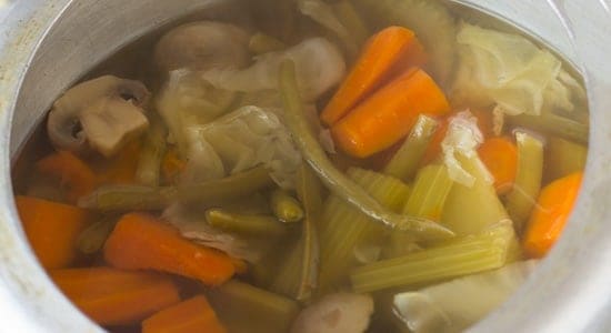 making vegetable broth with vegetable scrapes.