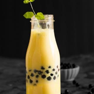 Mango boba smoothie recipe is made with fresh mango, yogurt, and boba. A sweet tropical smoothie can be served for the breakfast or mid-day meals.