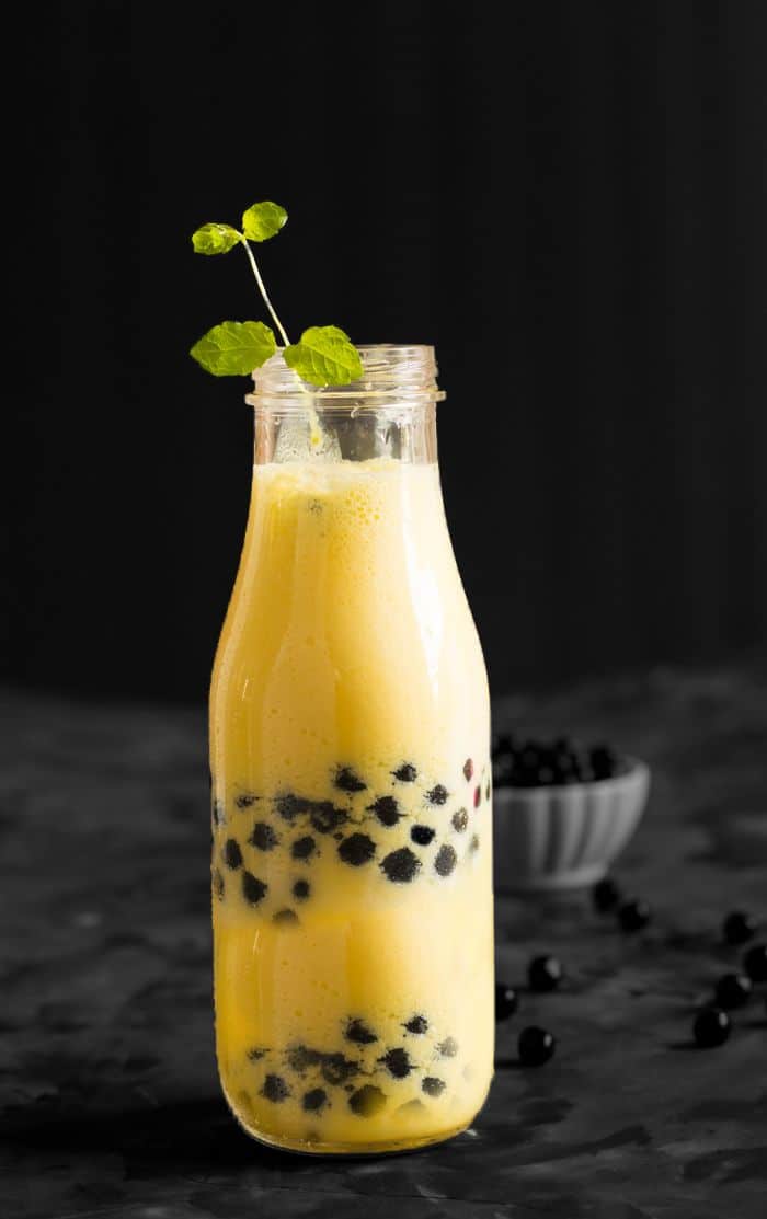 Mango boba smoothie recipe is made with fresh mango, yogurt, and tapioca pearls. Learn how to make this restaurant-style drink at home easily. Best drink to serve for the breakfast or mid-day meals.