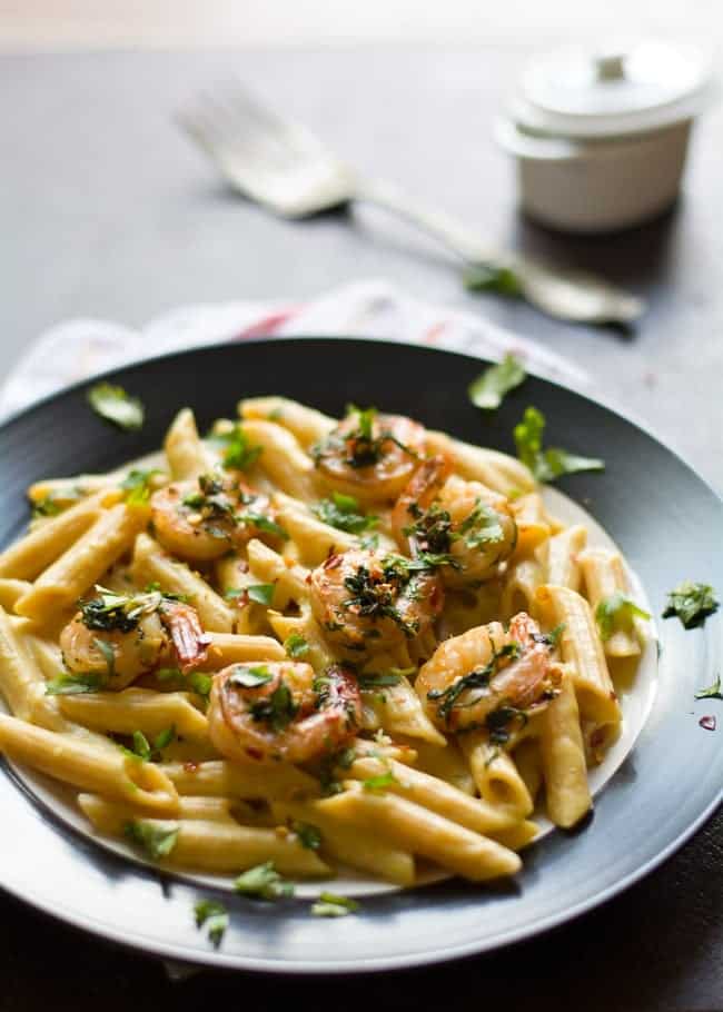 BEST Creamy spicy shrimp pasta with cilantro lime sauce is an easy, spicy and tasty recipe. Made with milk, garlic, and crushed red pepper. Great comfort food perfect for family dinner.