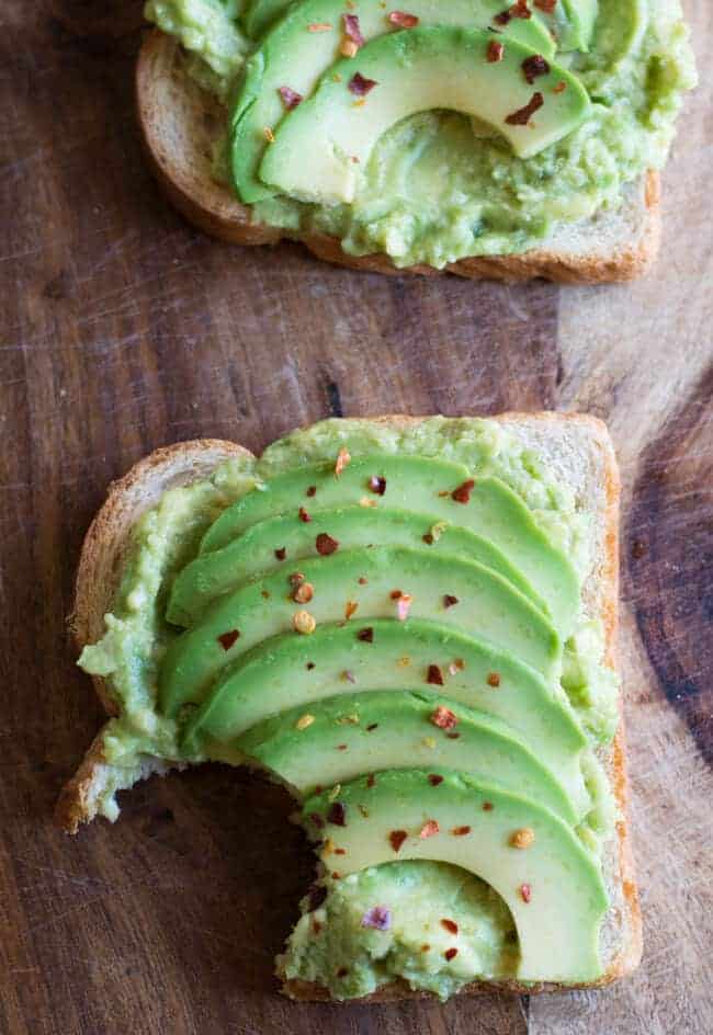 Spicy avocado Toast is vegan and healthy. Learn how to make this simple breakfast with smashed avocados and lime. Make it spicy by sprinkling chili flakes on the top. 