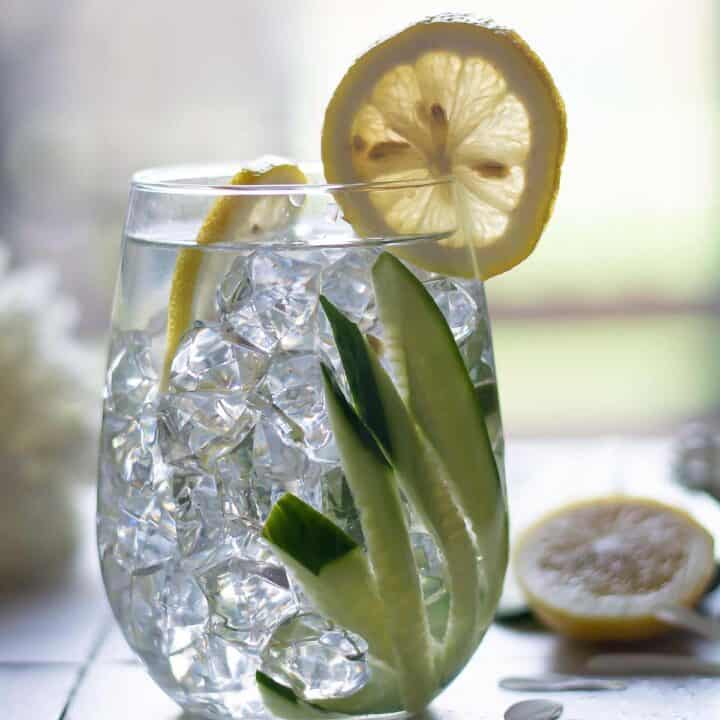 cucumber water with a lemon slice
