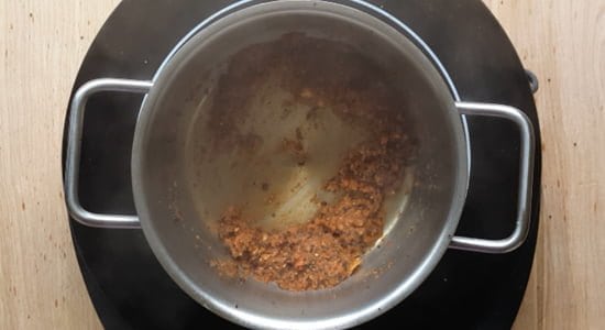 Sauteing the ground mixture in oil