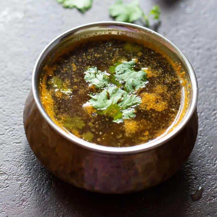 pepper rasam placed in a serving bowl