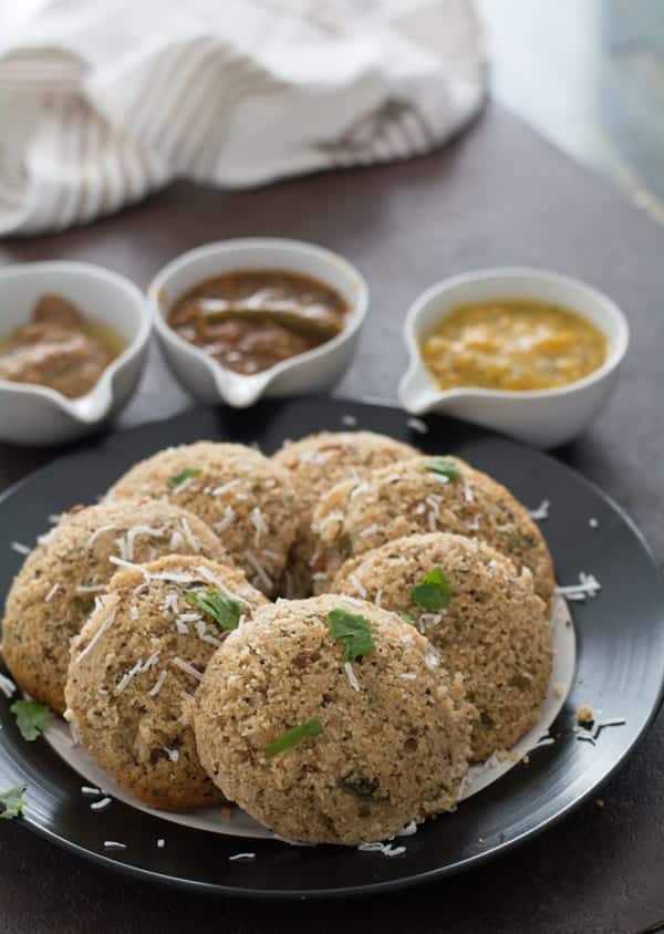 Oats idli recipe is easy and simple to make. Learn how to make this healthy breakfast with step by step pictures. Made under 30 minutes. The idli is fluffy, spongy and soft. Best to be served with chutney.