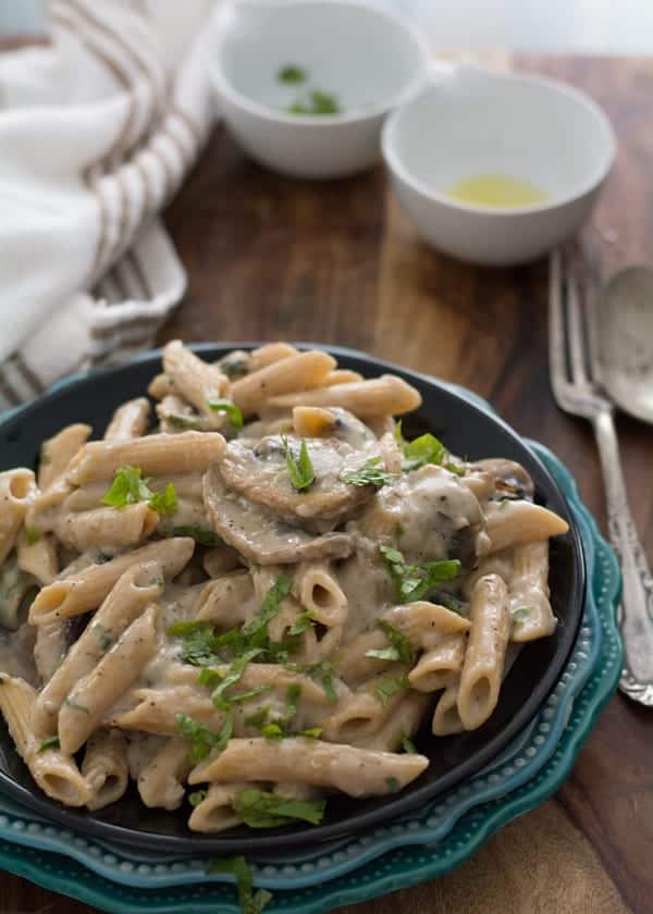 One pot skinny cream of mushroom pasta sauce seasoned with crushed peppercorn and cilantro, made made in less than 20 minutes.