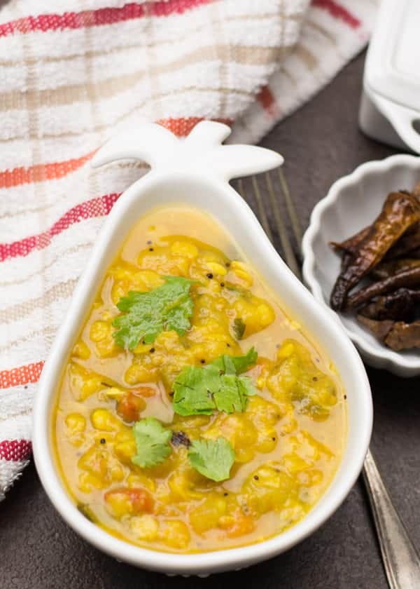 Dosakaya pappu-Indian lentil dal made with yellow cucumbers, toor dal, onion, tomatoes, and turmeric powder. A everyday comfort food made in Andhra style. in traditional way