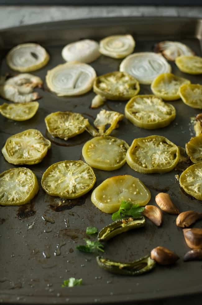 Roast vegetables by keeping in preheated oven on 400°F for 20minutes to make perfect oven roasted green tomato salsa.