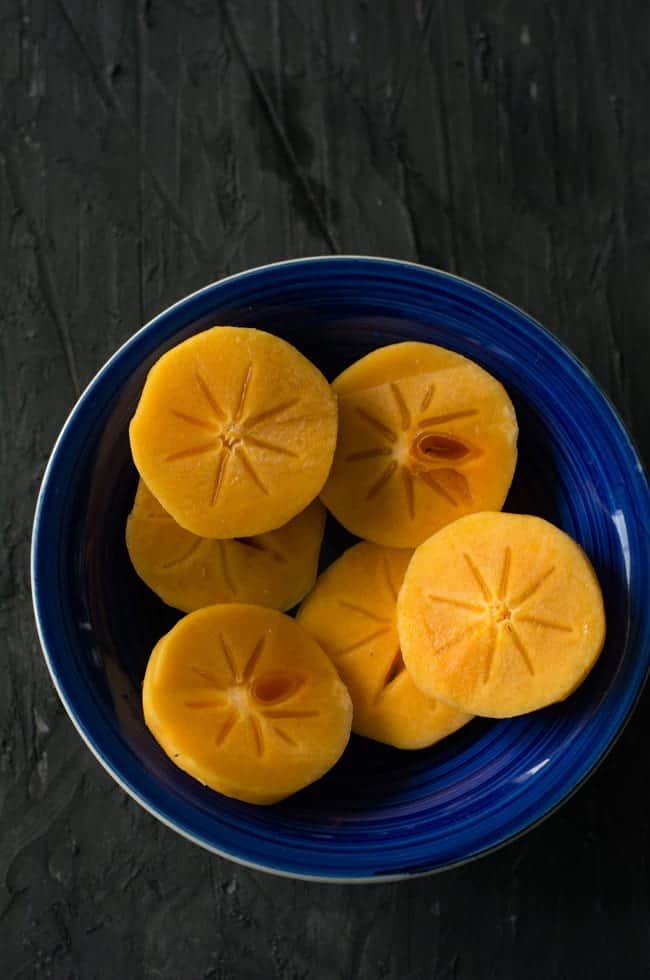 how to cut persimmon to make persimmon smoothie. Peel and slice them.