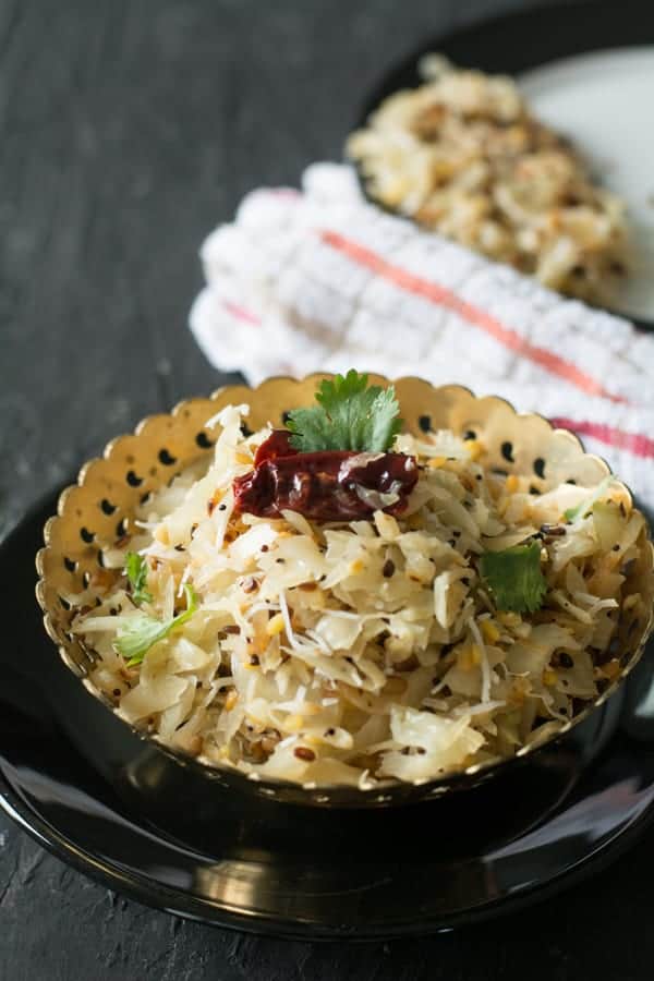 Cabbage poriyal-Indian style cabbage stir-fry made with shredded cabbage, coconut, and mustard seeds. Another simple everyday side dish recipe in less than 15 minutes.