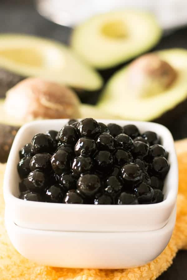 To make avocado boba tea, Boba is available in different sizes and two colors. Black and white. When cooked, the large varieties would turn to the size of small marbles. The large black size is the one you get in takeouts and in restaurants. 