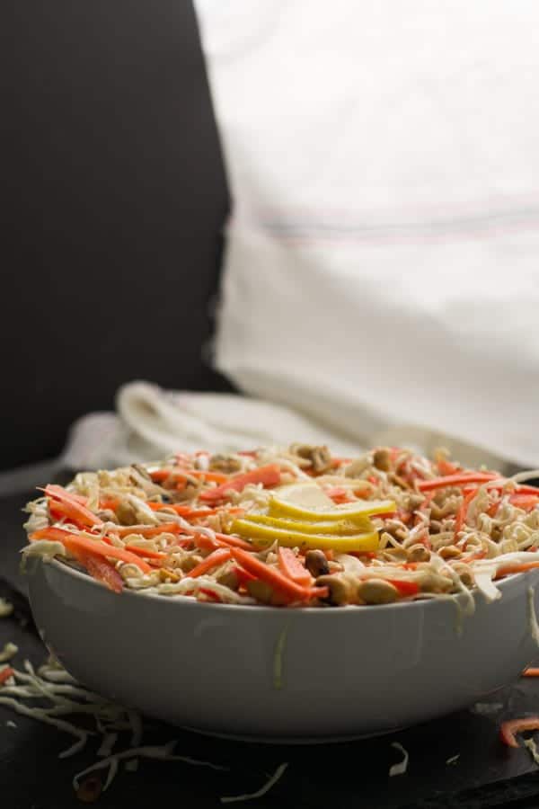 How to make spicy Asian cabbage salad recipe? Simply,  Chop the vegetables- Chopping them to the size of the match stick will make half of the work done. Cutting cabbage, carrot, red pepper this way makes it authentic.