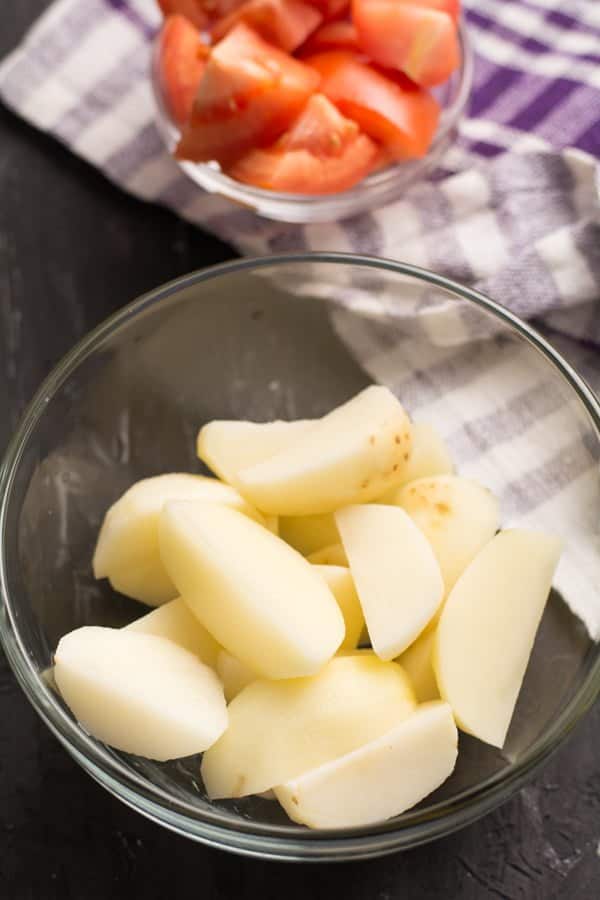 potato is cleaned, peeled and cubed for making Instant pot potato curry