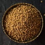 fenugreek seeds in the white bowl for Indian cooking