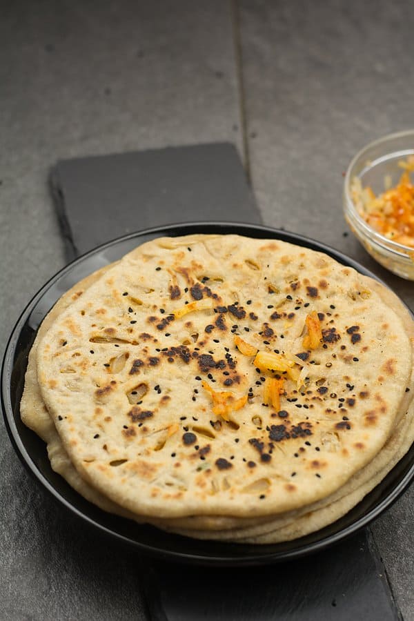 Why you should make this onion kulcha recipe? This is easy and simple made in tawa or oven. Made with healthy ingredients, and will not leave you with the guilt of eating fatty or unhealthy food. 