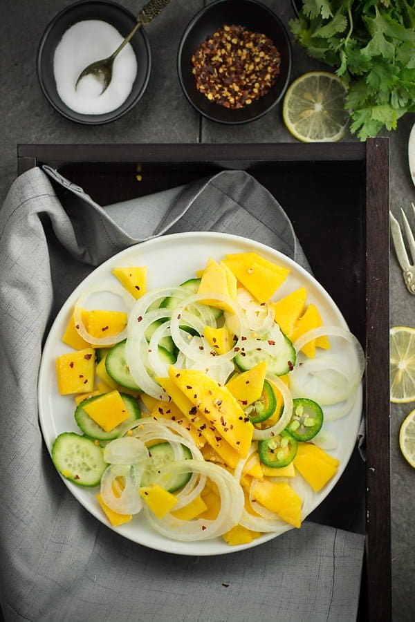 Cucumber mango salad's shelf life is really short and can last upto a day when refrigerated. When planning to store this salad for a long time, I would suggest cutting the mango and store in the refrigerator separately.