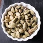 cardamom in white bowl, important ingredient originated from India