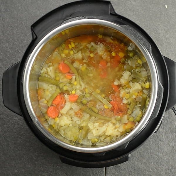 Spicy vegetable soup is ready in Instant pot with fork tender vegetables.