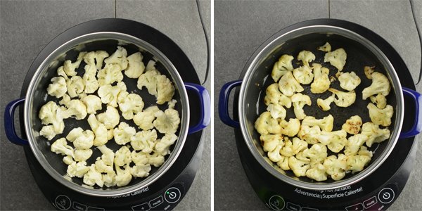roast the cauliflower florets in a pan over medium heat. Roast until it changes its color and shrinks down a little to make Indian style cauliflower  side dish.