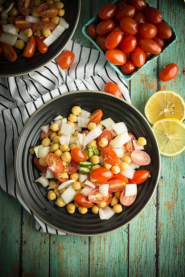 Indian tomato salad is vegan, vegetarian salad. A delicious and quick Indian meal accompaniments. And the best salad to go with butter chicken. Just roughly chop the vegetables and toss with the spices. 