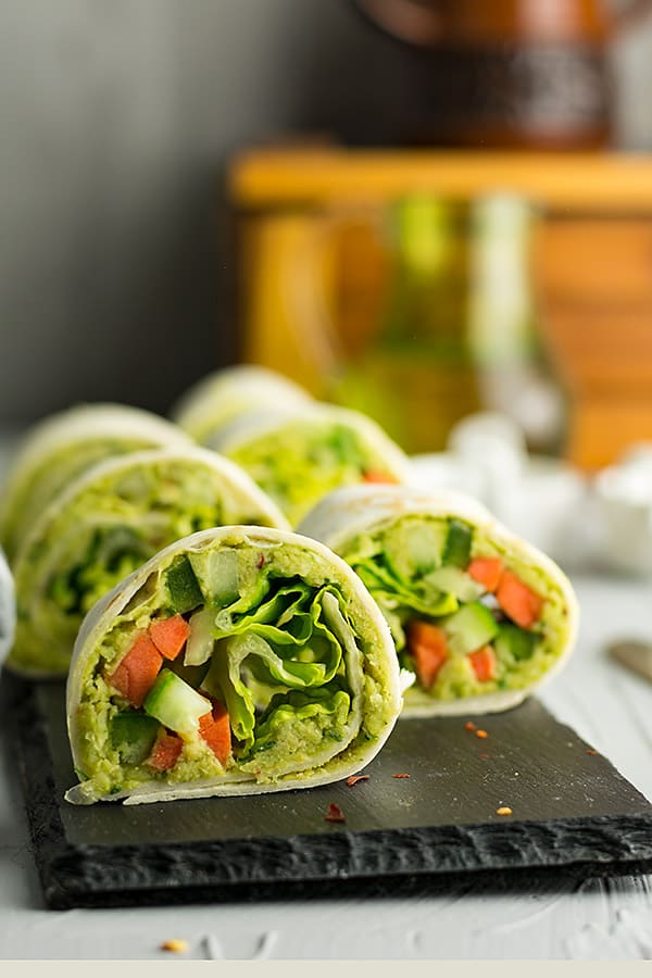 This party pinwheel can customized to everyone's personal preference, placed in a serving plate. Made with chickpea hummus, lettuce, carrot, cucumber.