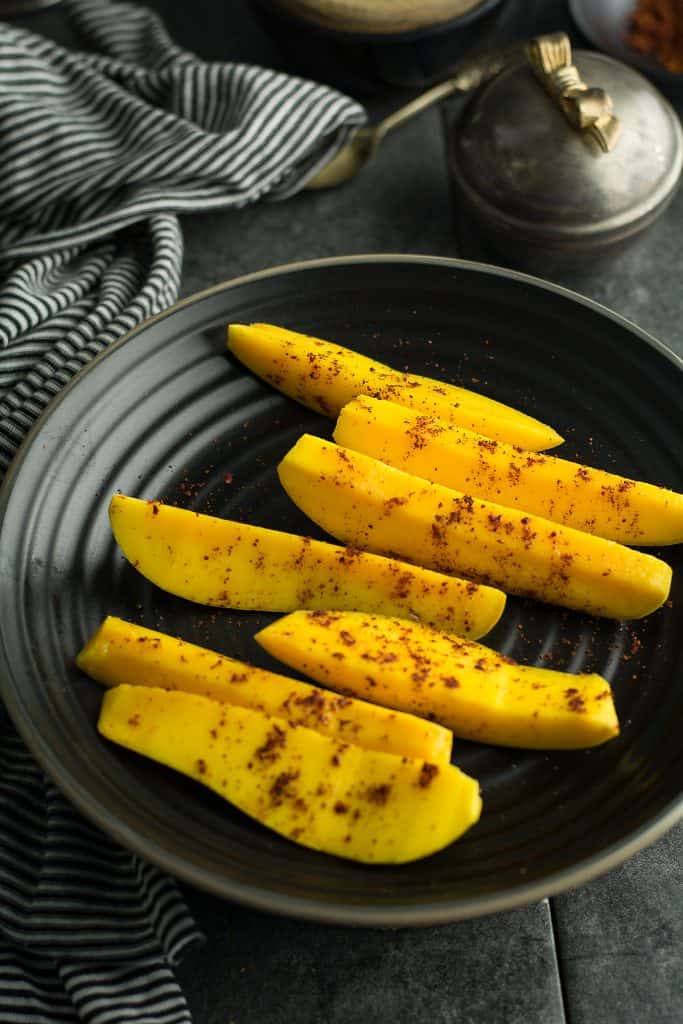 Mango with chili powder is a spicy fruit snack  that ready under 5 minutes.