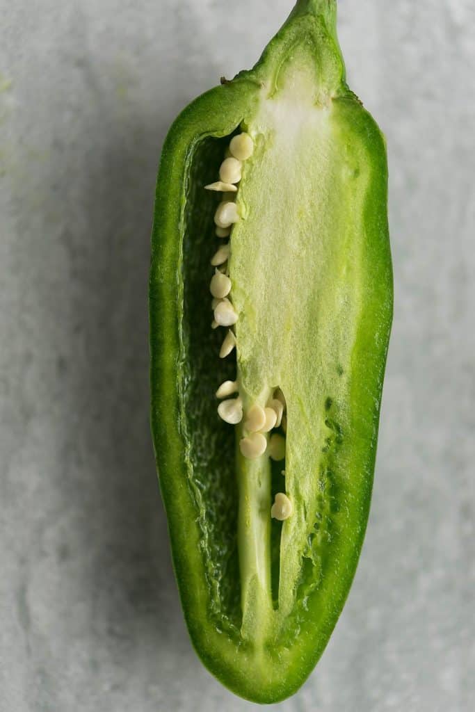 The seeds and the white membrane holds most of the heat. A jalapeno with the seeds and the membrane is the picture.