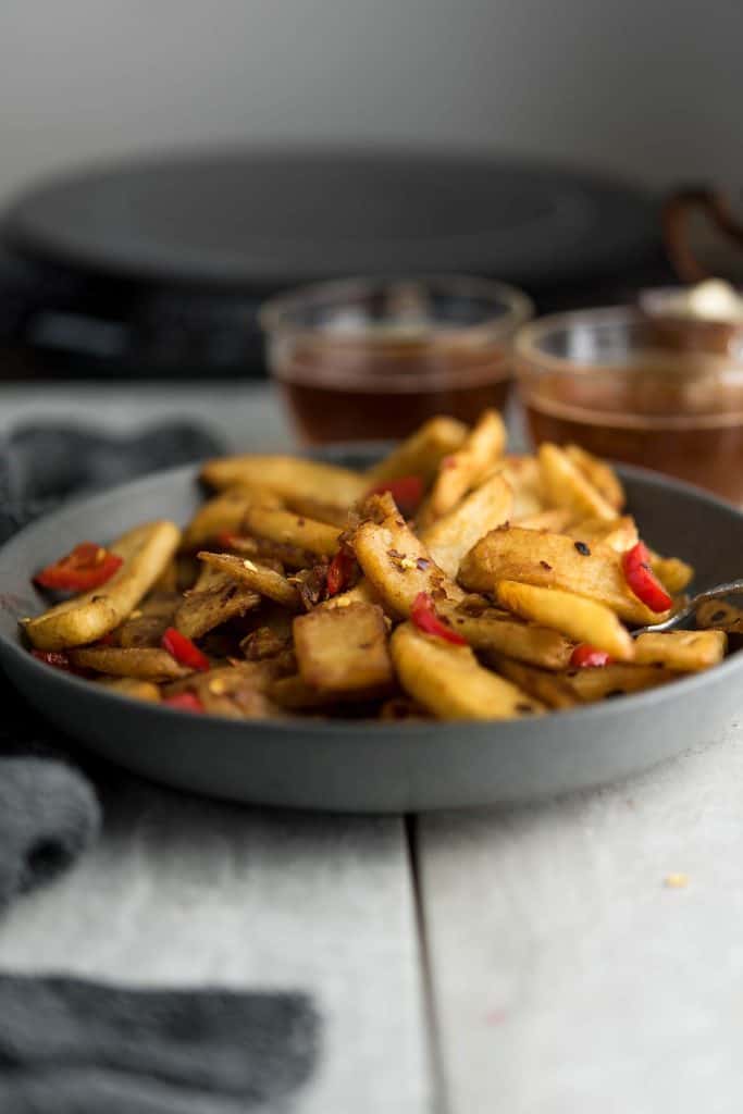 This spicy sauce coated 
Chinese fries is  served with tea