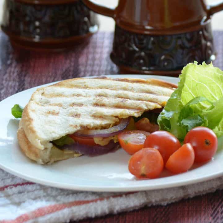 The grilled veggie sandwich is a healthy and quick recipe, made with onion, tomato, cucumber, avocado. P