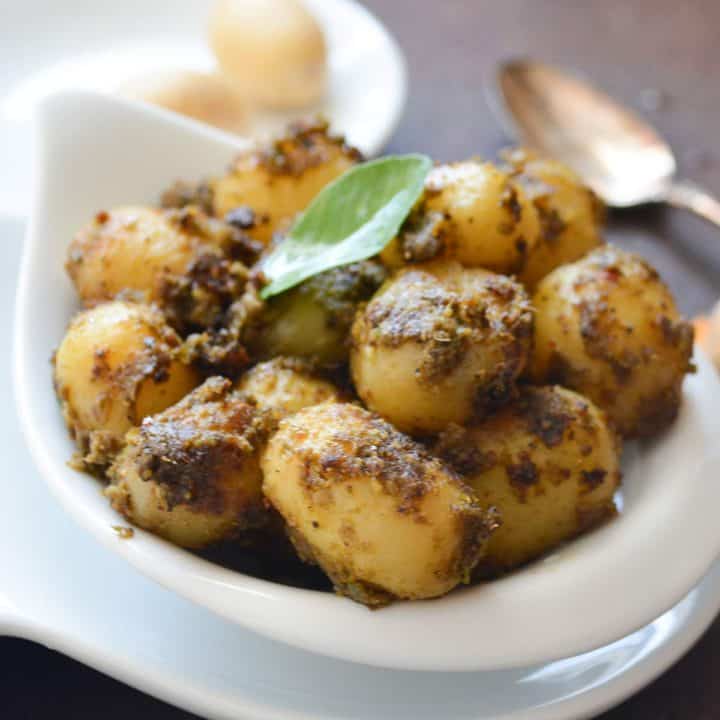 Spicy baby potato fry with warm Indian spices.