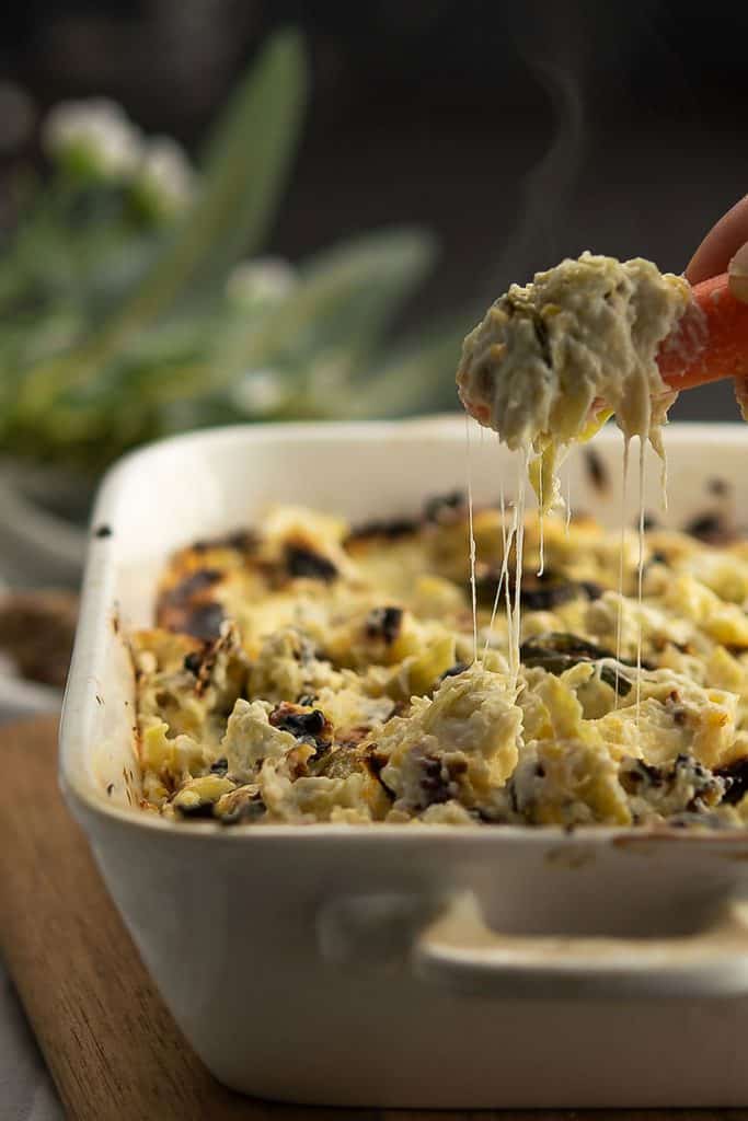 jalapeno artichoke dip is cheesy placed in a dipping bowl