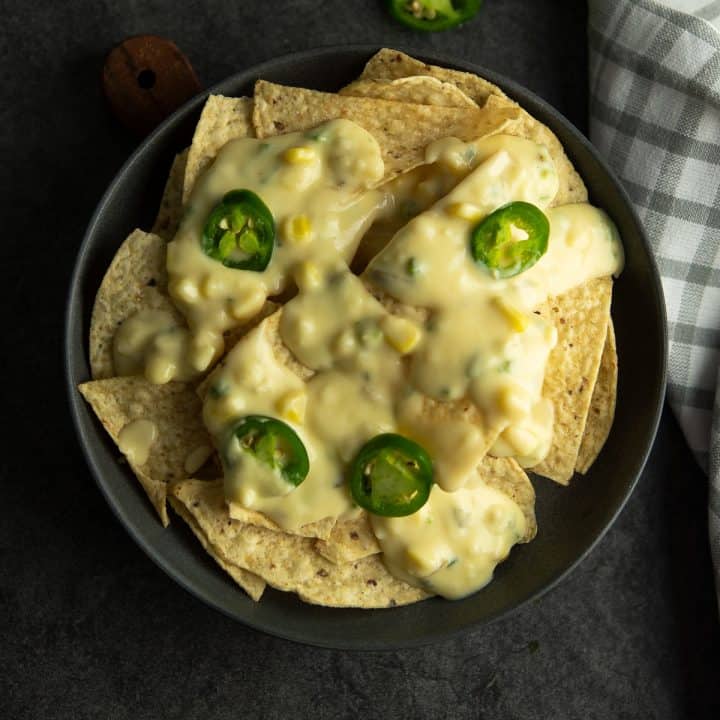 Spicy jalapeno nachos served with creamy cheese sauce.
