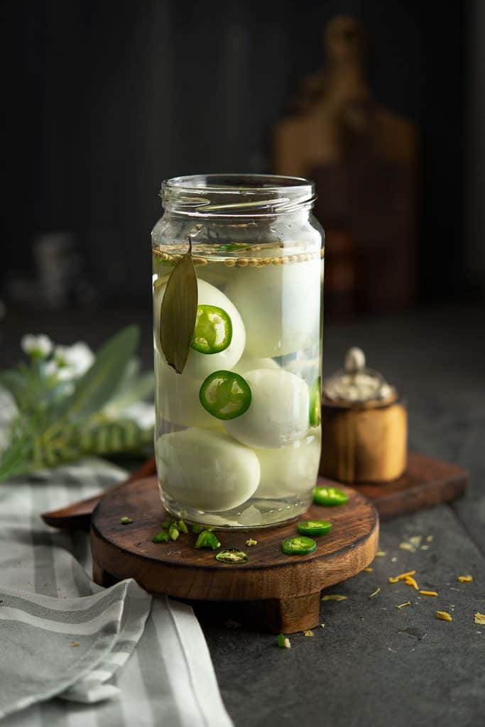 jalapeno pickled eggs stored in the mason jar.