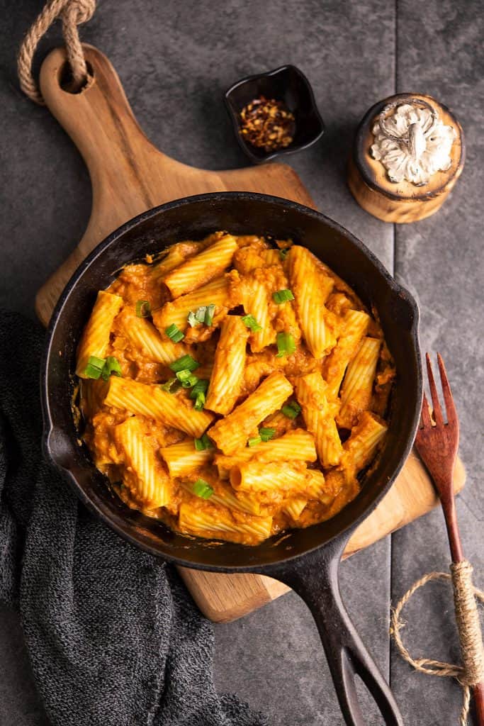 Spicy rigatoni pasta in the rich vodka tomato sauce, placed in a pan.