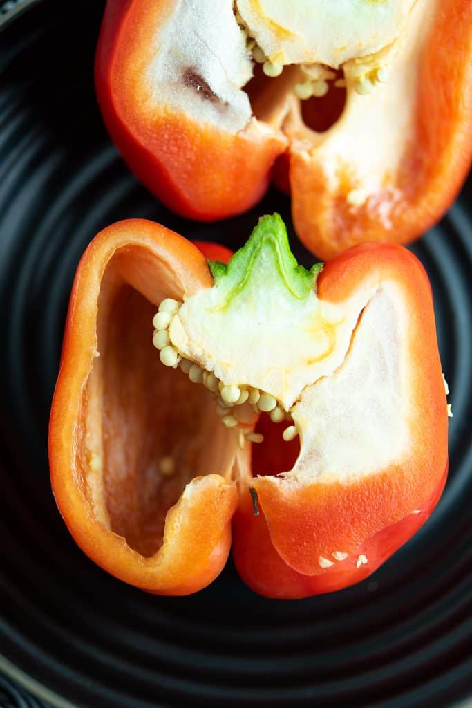 Bell peppers with white membrane and seeds.